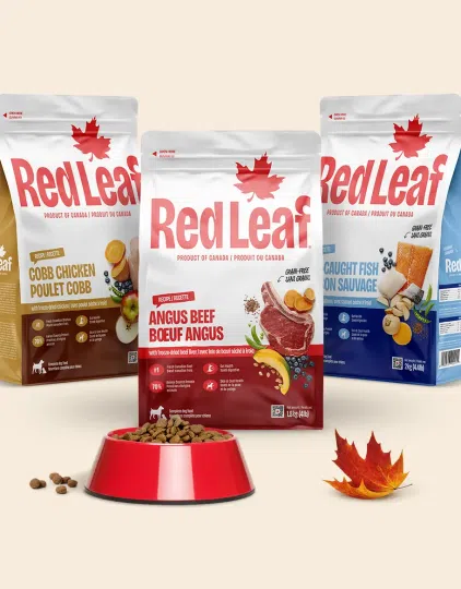 Red Leaf dry food bags with bowl of dog food